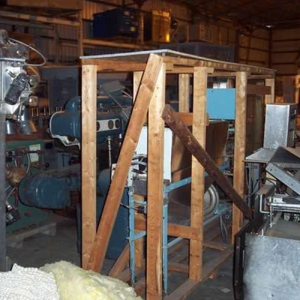 VERTICAL BELT DRIVEN ROTARY CAP FEEDER